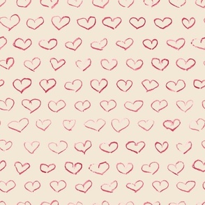 Red crayon drawn hearts on cream background