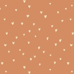 Delicates heart pattern on a terracotta background