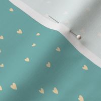 Delicates heart pattern on a light teal background