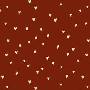 Delicates heart pattern on a brown background
