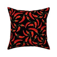 Chili peppers on black - large scale