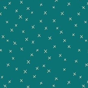 Delicate cross pattern on teal green