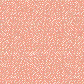 white dot on coral pink