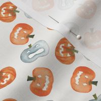 Watercolour jack o lantern in orange and blue on white for halloween, cute pumpkins for Fall holidays