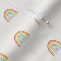 Bright watercolor rainbows small on cream for babies, kids and nursery wallpaper. perfect for children's wear