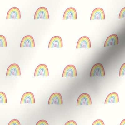 Bright watercolor rainbows small on cream for babies, kids and nursery wallpaper. perfect for children's wear