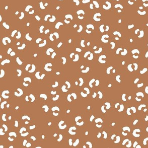 Messy single leopard spots minimalist boho animal print texture for wild baby nursery textiles caramel brown white