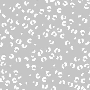 Messy single leopard spots minimalist boho animal print texture for wild baby nursery textiles soft gray white