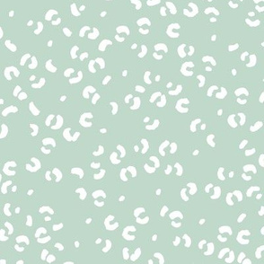 Messy single leopard spots minimalist boho animal print texture for wild baby nursery textiles mint green white