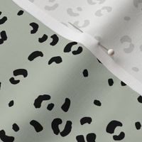Messy single leopard spots minimalist boho animal print texture for wild baby nursery textiles mist green black 