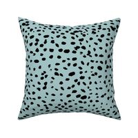 Wild organic speckles and spots animal print boho black marks on soft blue