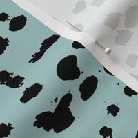 Wild organic speckles and spots animal print boho black marks on soft blue