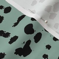 Wild organic speckles and spots animal print boho black marks on ocean green