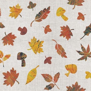 Falling rusty autumn leaves on grey linen