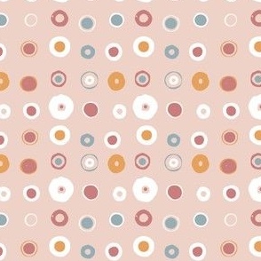 Abstract mix of geometric circles in pastel pink, baby blue and a touch of mustard yellow