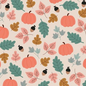Fall forest leaves and pumpkin fruit acorns and branches pink green cinnamon on beige sand 