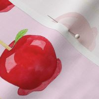 Large Scale Red Candy Apples on Pink