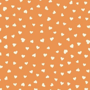 Little Hearts in beige on orange