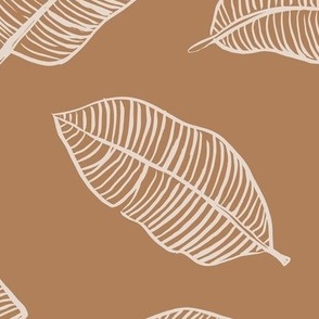 The jumbo banana leaf tropical boho leaves  jungle design for summer sand sienna brown caramel