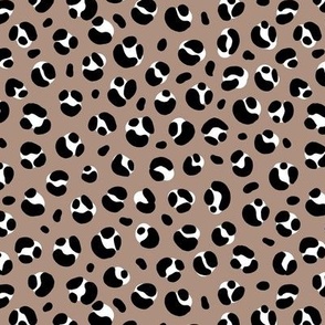 The bold leopard design animal print panther spots black and white on coffee brown latte