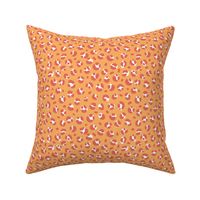 The bold leopard design animal print panther spots orange coral pink