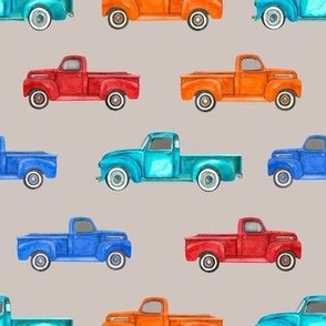Medium Scale Colorful Vintage Trucks  on Tan