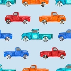 Medium Scale Colorful Vintage Trucks  on Light Blue