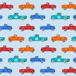 Small Scale Colorful Vintage Trucks  on Light Blue