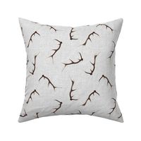 Antlers on textured gray