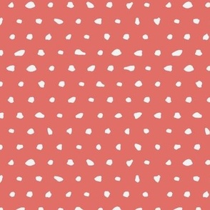 White hand drawn dots on red background