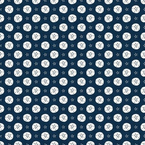 Small Scale Sand Dollars on Navy Blue Ocean Water Background 
