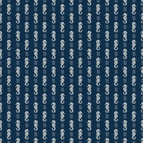 Small Scale Sea Horses on Deep Navy Blue Ocean Water Background