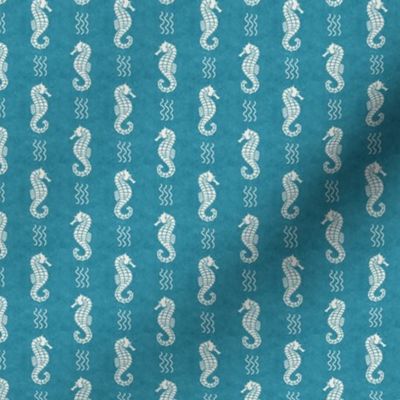Small Scale Sea Horses on Turquoise Blue Ocean Water Background