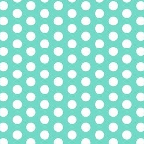 White polka dots on blue green background