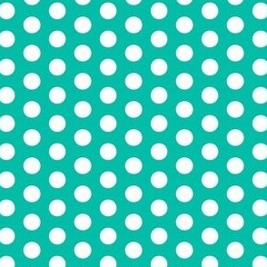 White polka dots on blue green background