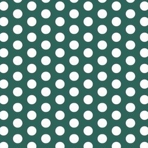 White polka dots on a green background 
