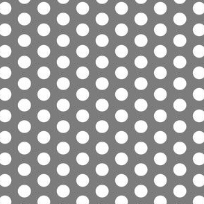 White polka dots on a dark gray background 