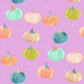 pumpkins of fall on bright lavender