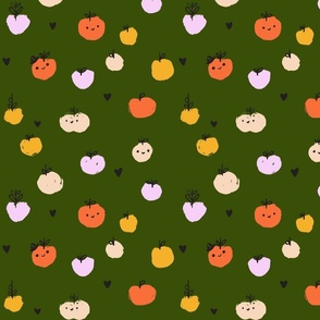 Cute apple faces on green