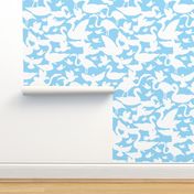 White birds silhouettes on light blue repeat pattern