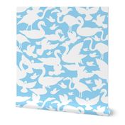 White birds silhouettes on light blue repeat pattern