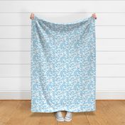 White birds silhouettes on light blue repeat pattern