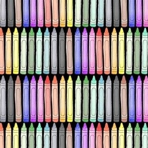 Crayons in a row on Black