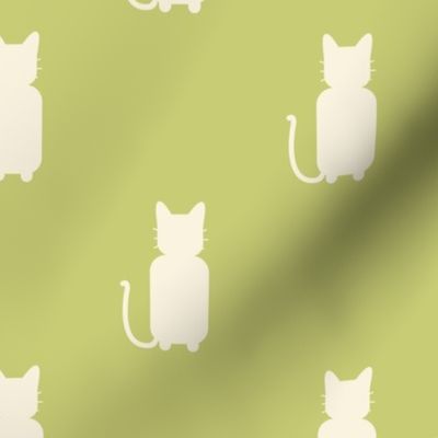 Beige cats on green