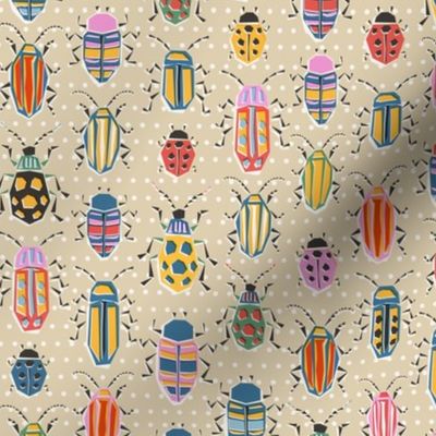 small- colourful retro bug collection/ lighter - on polka dotted sand - small scale
