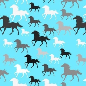 Running horses on blue
