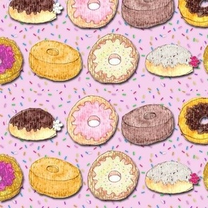 Donuts on pink with sprinkles