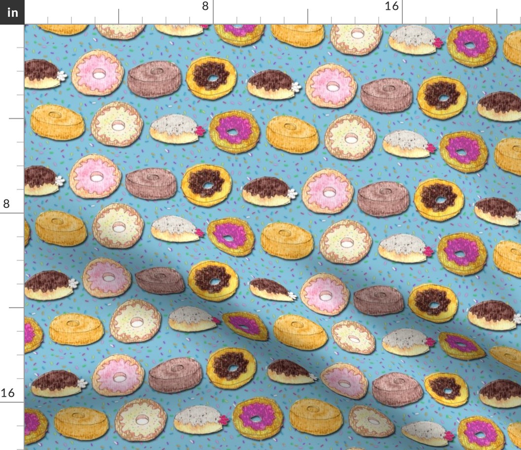 Donuts on blue with sprinkles
