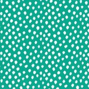 White spots on teal green