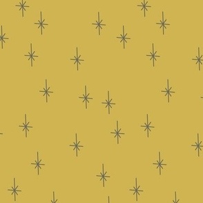 sparkling celestial stars on mustard yellow